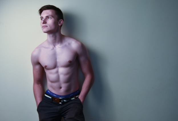 a man standing by the wall